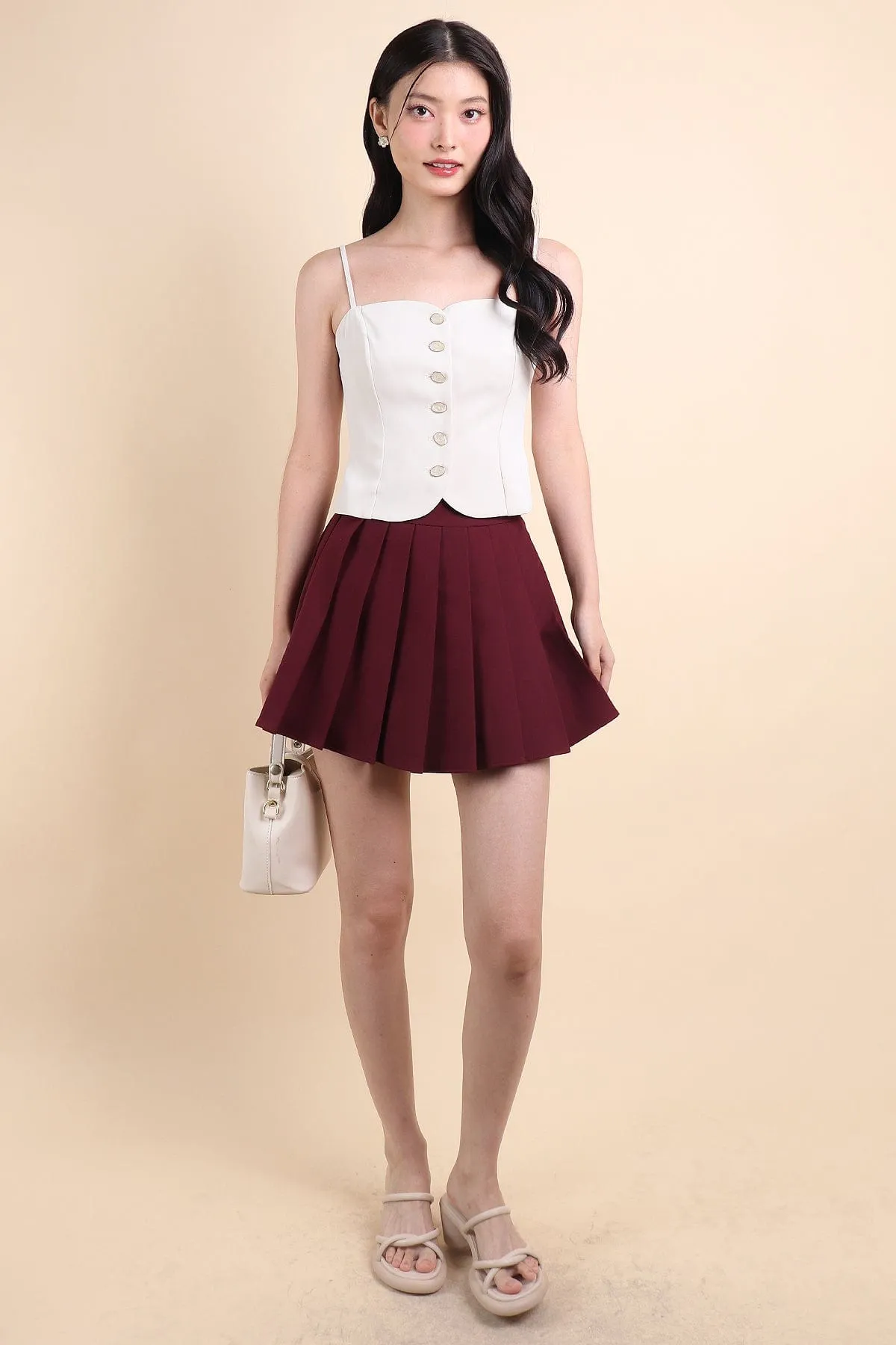 CAMU PLEATED SKIRT IN WINE