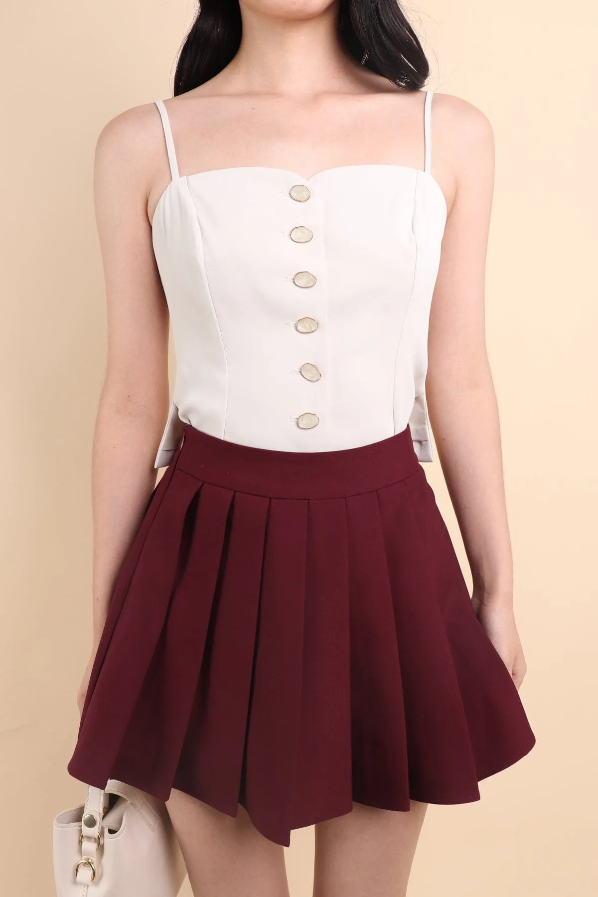 CAMU PLEATED SKIRT IN WINE