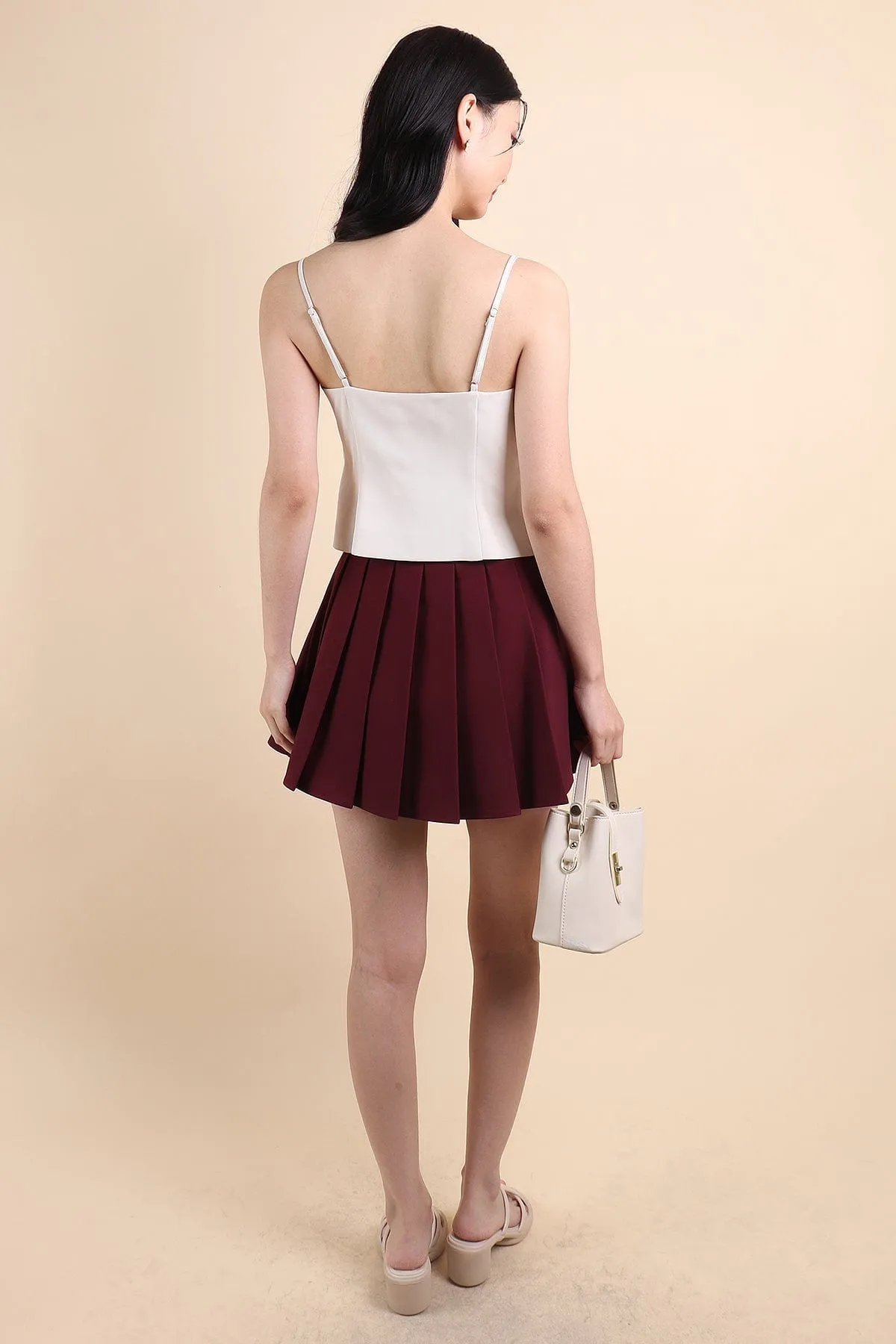 CAMU PLEATED SKIRT IN WINE