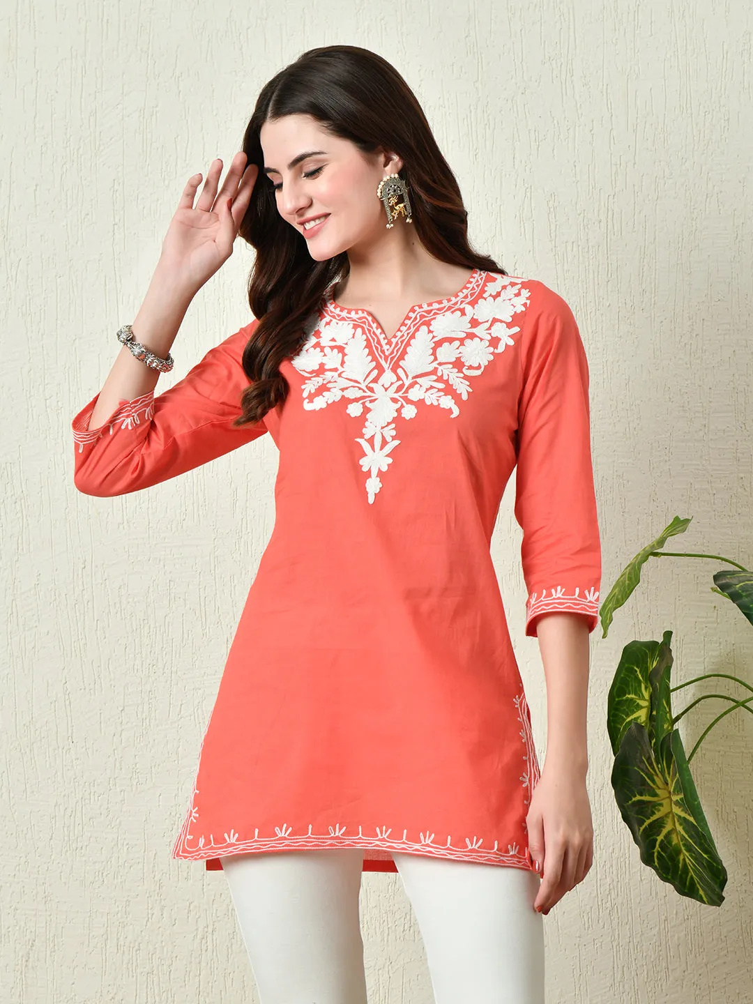 Women Stylish Peach Cotton Short Kurti With Elegant Work