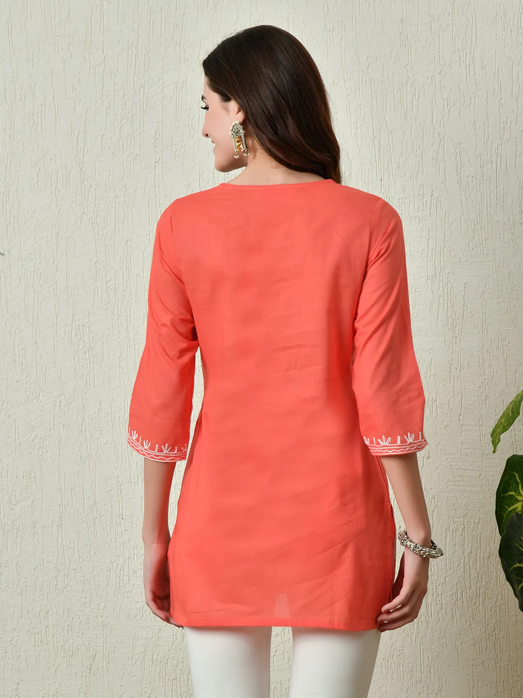 Women Stylish Peach Cotton Short Kurti With Elegant Work